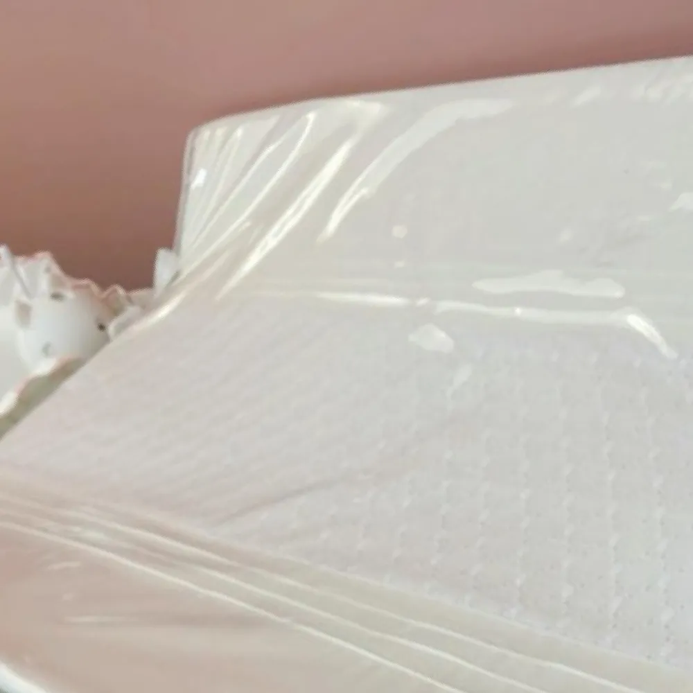 Ninho para bebê branco com acabamento em matelassê